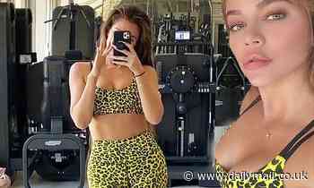 Khloé Kardashian puts her chiseled abs on display in vibrant gymwear as she prepares to work out