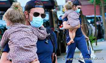 Bradley Cooper carries daughter on in New York City outing