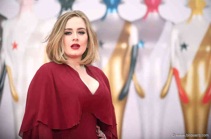 Adele Shares Mysterious Photo of Herself Performing On Stage