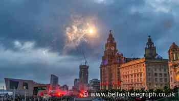 Man arrested on suspicion of arson after firework thrown at Liver Building