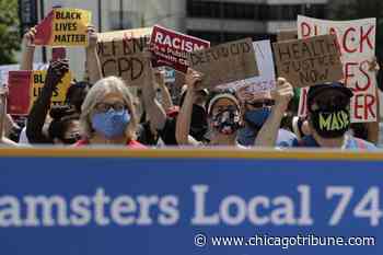 Health care workers demand justice in Medical District march - Chicago Tribune