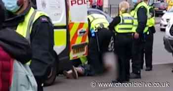 Two men charged with breaching protest ban after anti-racism event in Newcastle