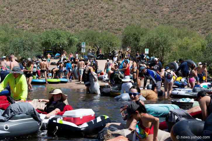 Crowds pack Arizona river as U.S. posts record COVID cases for three days running