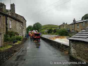 Bikers winched to safety after trying to drive through flooded ford