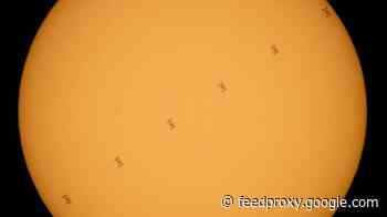 ISS looks like Star Wars TIE fighter as it crosses the sun in NASA image     - CNET