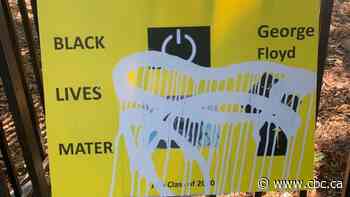 Grade 6 students made posters about anti-Black racism. Someone vandalized them with paint.