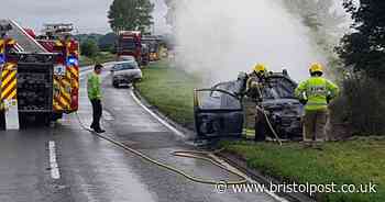 Car fire breaks out on side of busy road