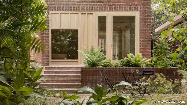 Grove Park house by O'Sullivan Skoufoglou Architects has wooden lining and verdant views