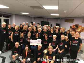 "Sometimes you've got to put your happy face on": Meet the Bromley Cross singers putting smiles on people's faces