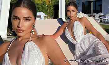 Olivia Culpo takes the plunge in sizzling white lace frock as she lounges in the backyard