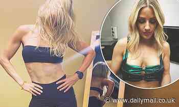 Ellie Goulding displays her taut abs and endless legs in tiny black crop-top and Lycra shorts