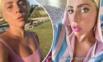 Lady Gaga flashes her cleavage as she switches up her lockdown look with glam pink lipstick