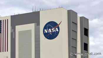 Watch a 110-foot-tall NASA meatball logo get a fresh coat of paint     - CNET