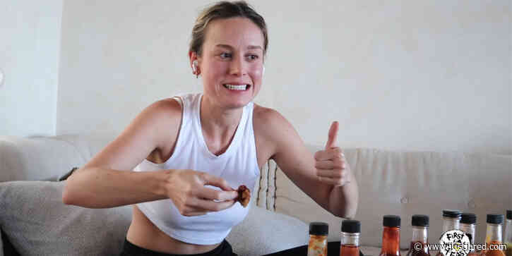 Brie Larson Reveals the Full Story of her Famous Kardashian Met Gala Selfie While Playing 'Hot Ones' - Watch! (Video)