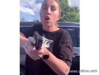 White woman filmed pulling gun on black family after bumping into them