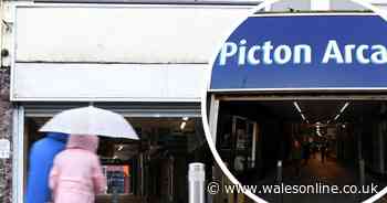 Signs at Welsh arcade named after slave trader removed ahead of protest