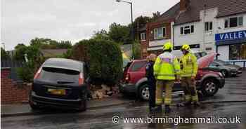 Crash sees car plough into garden wall