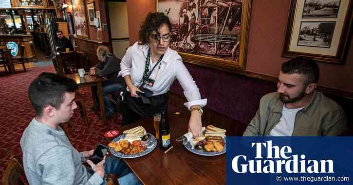 English pubs pour first pints for customers since lockdown began