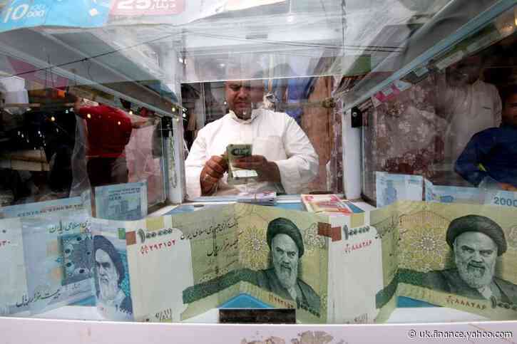 Iran rial slides to new low as coronavirus, sanctions weigh