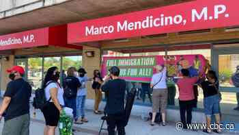 Protesters gather at minister's office, demand more rights for migrant workers