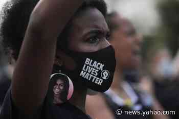 The Latest: Columbus statue yanked, tossed into Inner Harbor