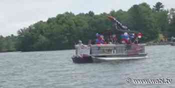 Dozens celebrate the holiday weekend with a boat parade on Swan Lake - WABI