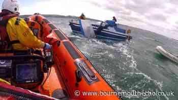 Poole lifeboat helps people clinging to buoy in Studland Bay