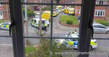 Man arrested after two paramedics stabbed at house - updates