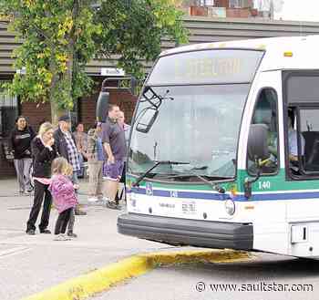 Bus riders to enter front doors, resume payment