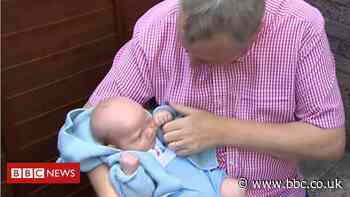 Coronavirus: Grandfather finally holds baby for the first time