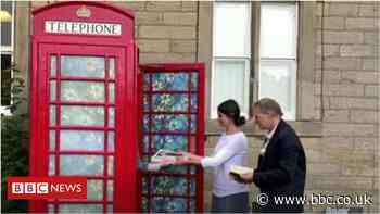 Girl transforms Matfen phone box into book swap