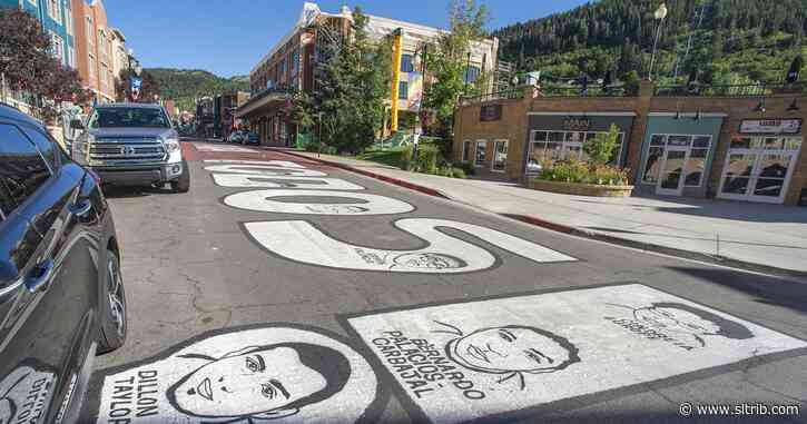 ‘Black Lives Matter’ and other messages about justice are painted on Park City’s historic Main Street