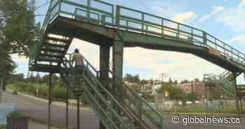 Pedestrian bridge over 14 Street in northwest Calgary changing to at-grade crossing