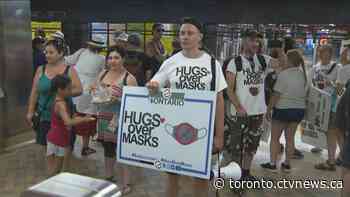Protesters ride TTC without masks to call for an end to mandatory face coverings in Toronto