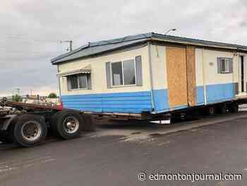 Highway patrol seizes transport truck carrying mobile home on QEII during a storm - Edmonton Journal