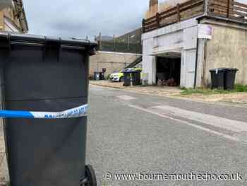Police tape off more than 20 black bins in Bournemouth street