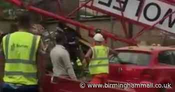 Crane collapses onto London house leaving people trapped inside