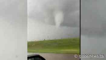 Driver captures video of large funnel cloud near Brooks, Alberta