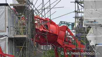 People injured as crane collapses on houses
