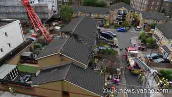 One dead and others ‘lucky to be alive’ after crane collapses on to houses