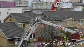 Elderly woman rescued by locals after crane collapsed on house – eyewitness