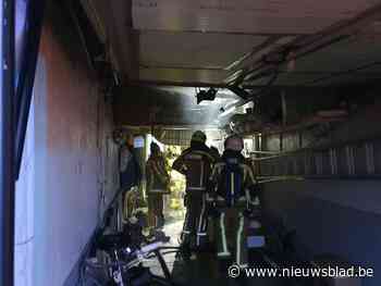 Schade in garage door brandende waterverwarmer