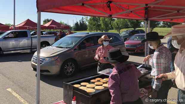 Thousands of Calgary families enjoy drive-thru Stampede pancakes