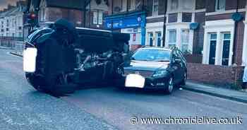 Car flips on it roof following incident on a road in Walker