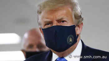 US President Donald Trump wears a mask in public for first time during pandemic