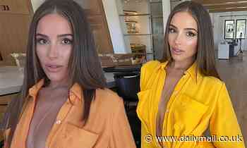 Olivia Culpo looks undeniably angelic in a brightly colored jumpsuit