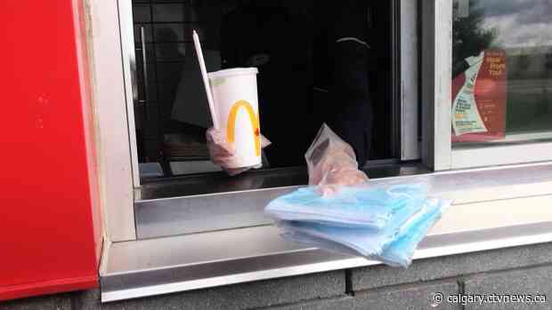 Free face mask distribution returns to Alberta drive-thrus, province to review COVID-19 response