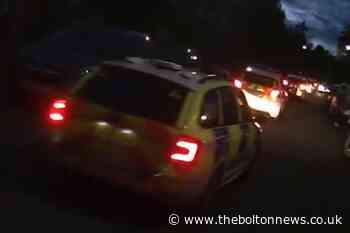 Motorcyclist helmet cam shows Bolton estate swarming with police