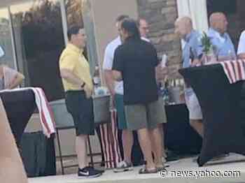 Photo shows Arizona's governor without a mask at party with no social distancing days before telling constituents to 'arm yourself with a mask'