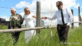 Cross-border wedding day brings families in U.S. and Canada together over barbed wire fence